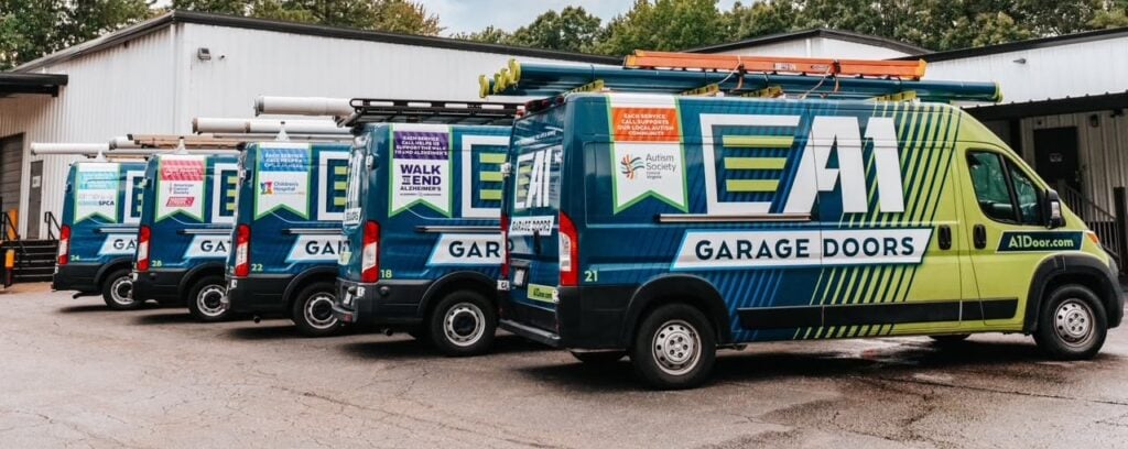 branded giving back a1 door company trucks - community logo